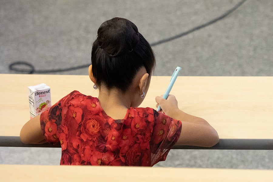 A student writes at a desk during an activity at a Saturday Morning Physics event at Florida State University on Oct. 18, 2025. Photo by Carly Nelson.