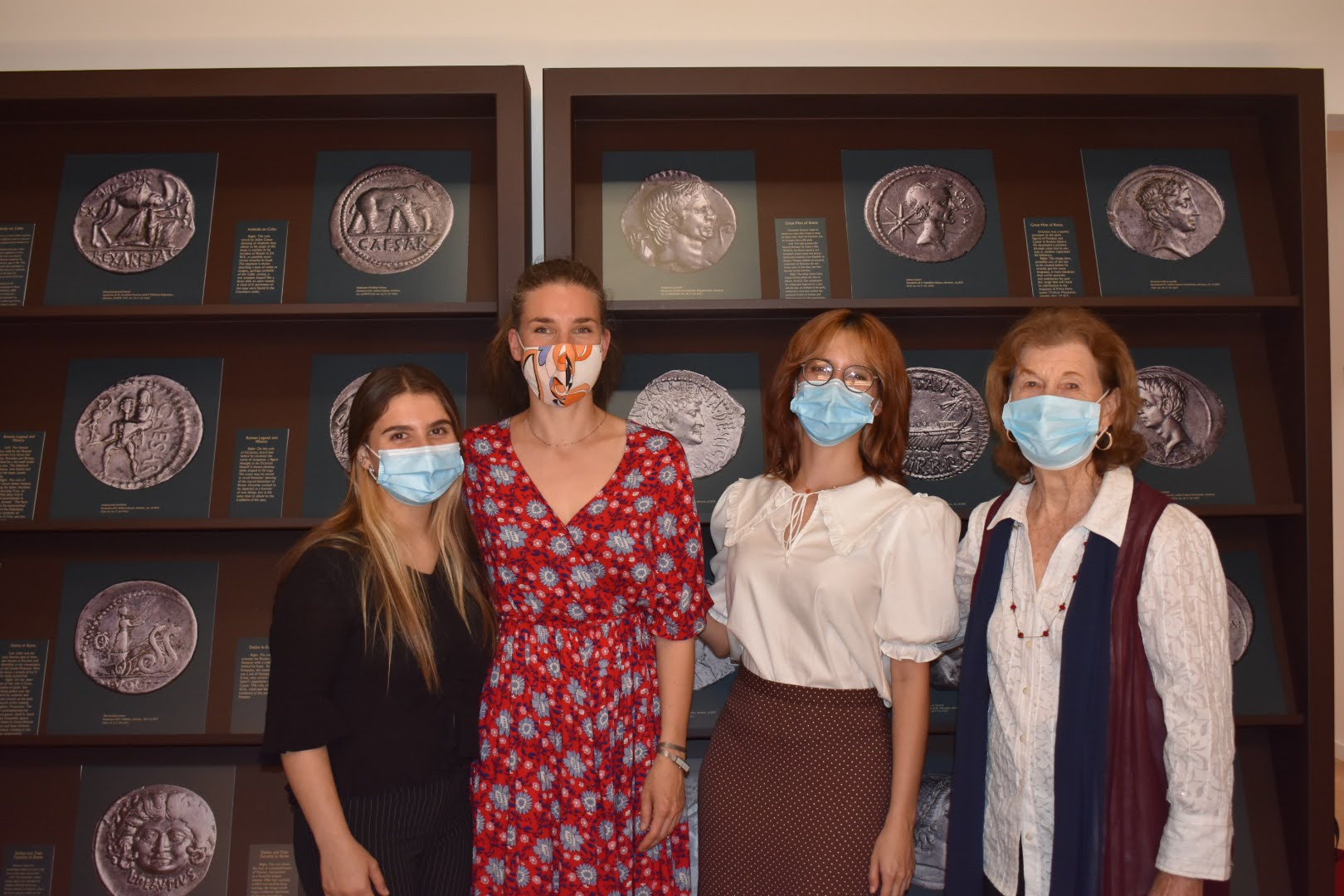 Classics student Jamie Fontana, archaeologist Nóra Marosi, classics student Nina Perdomo, and faculty Nancy de Grummond at Fontana's and Perdomo's museum exhibition in the Palazzo Bagnesi. Courtesy photo.