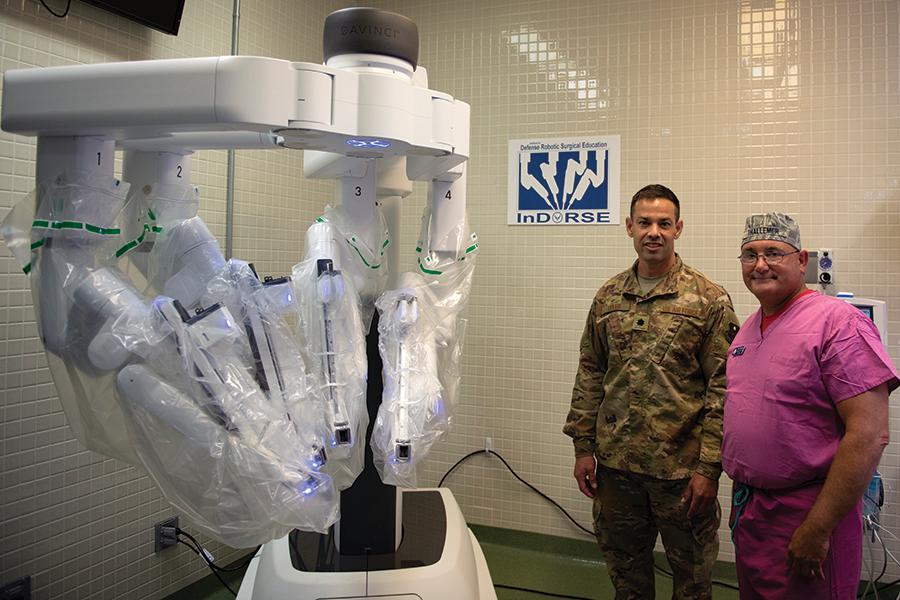 Tyler, 81st Surgical Operations Squadron Institute for Defense Robotic Surgery Education director, and Air Force Maj. Scott Thallemer, 81st MSGS InDORSE robot coordinator, pose for a photo in the Clinical Research Lab on Keesler Air Force Base, Mississippi, June 27, 2019. U.S. Air Force photo by Airman 1st Class Kimberly L. Mueller.