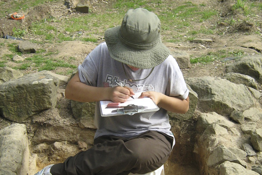 2010 – Caroline Cheung taking notes at an excavation site. Courtesy photo.