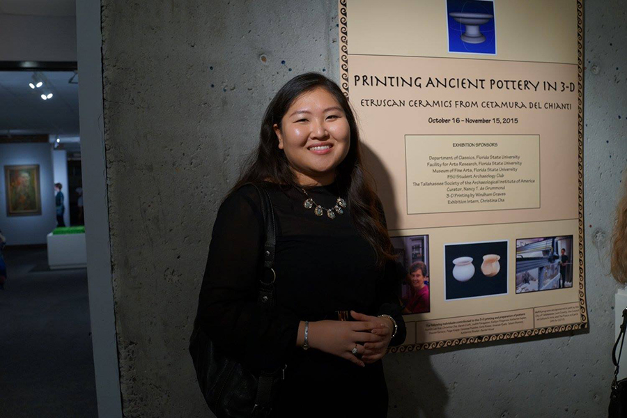 2015 – Christina Cha at Lighthouse Day in front of a Cetamura exhibition poster. Courtesy photo.