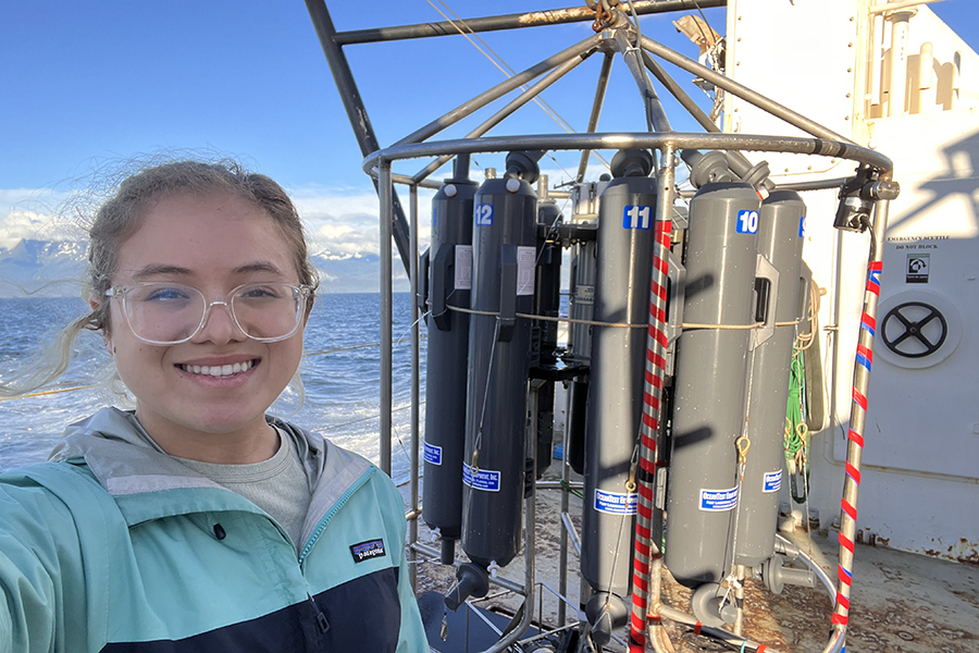 Andrea Emmanuelli aboard the R/V Rachel Carson with conductivity-temperature-depth sensors, which are used to study water properties like oxygen saturation and salinity. Photo courtesy Andrea Emmanuelli.