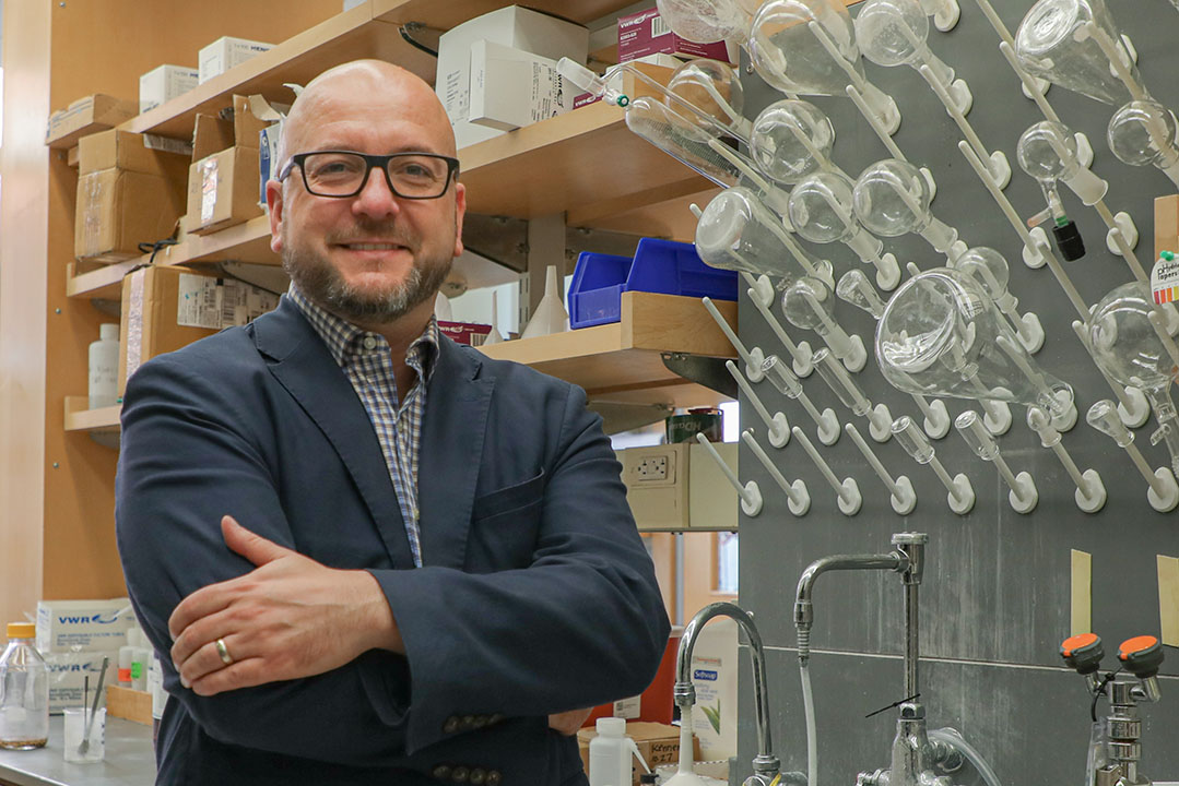 Associate professor of chemistry and biochemistry Justin Kennemur in his laboratory.