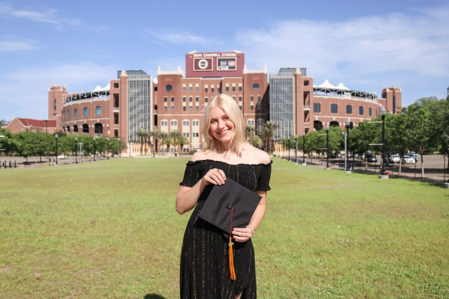 Sarah Moloney standing in front of Doak Campbell Stadium