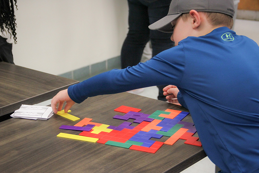 Attendees could participate in a variety of activities, including games exploring geometric construction and symmetries and patterns. (Carly Nelson/College of Arts and Sciences)