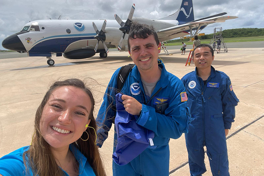 Andrew Hazelton and colleagues standing outside a NOAA Aircraft Operations Center plane before an expedition into Hurricane Franklin in 2023. Courtesy Andrew Hazelton.