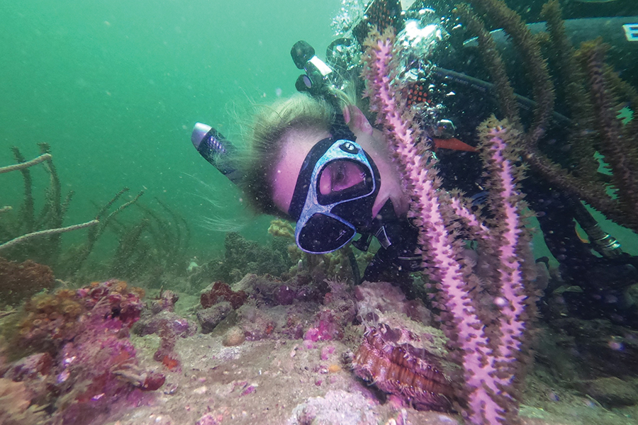 Biological science doctoral student Morgan Hawkins surveys underwater life. 