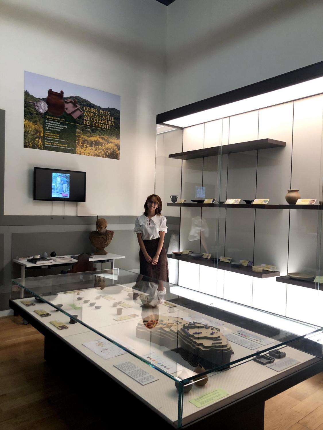 "Nina Perdomo presenting at the “Coins, Pots, and a Castle at Cetamura del Chianti" exhibition. Courtesy photo."